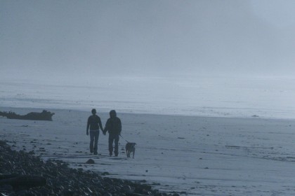 Couple and Dog on Beach in Blue